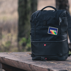 Woven cloth pride badge on a backpack 