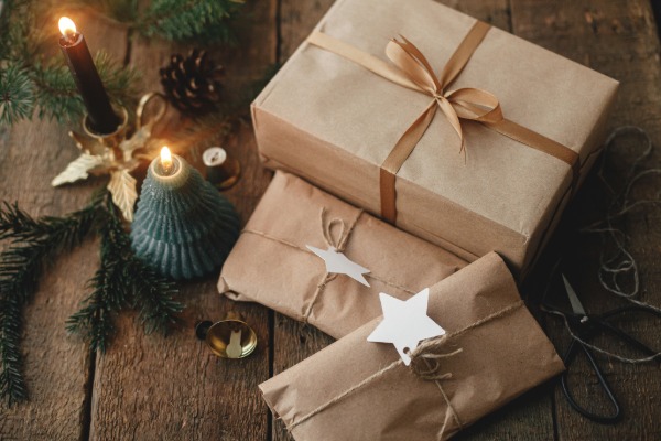Gifts wrapped in Scandinavian-style paper with natural, minimalist decorations.
