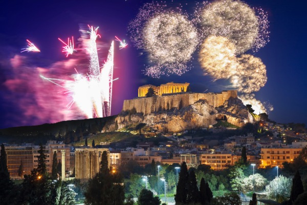 Colourful fireworks lighting up the night sky over a Greek city to celebrate the New Year.