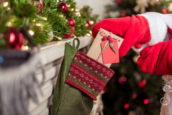 A tropical Christmas scene in Brazil featuring Papai Noel enjoying a beach setting.