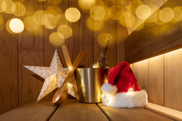 A red Santa hat placed inside a Scandinavian wooden sauna