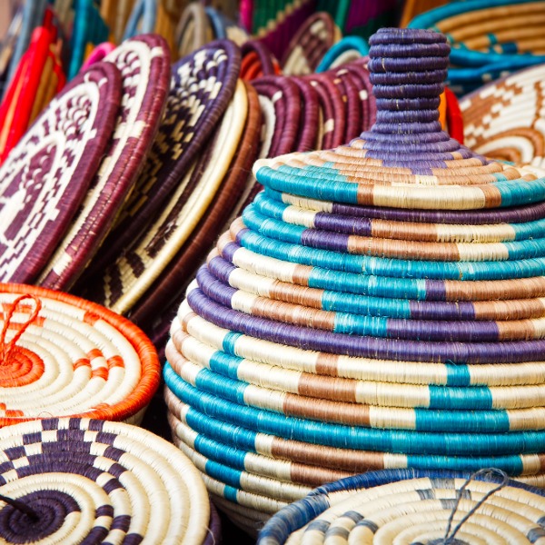 Handwoven African baskets with intricate patterns, showcasing traditional craftsmanship and natural materials.